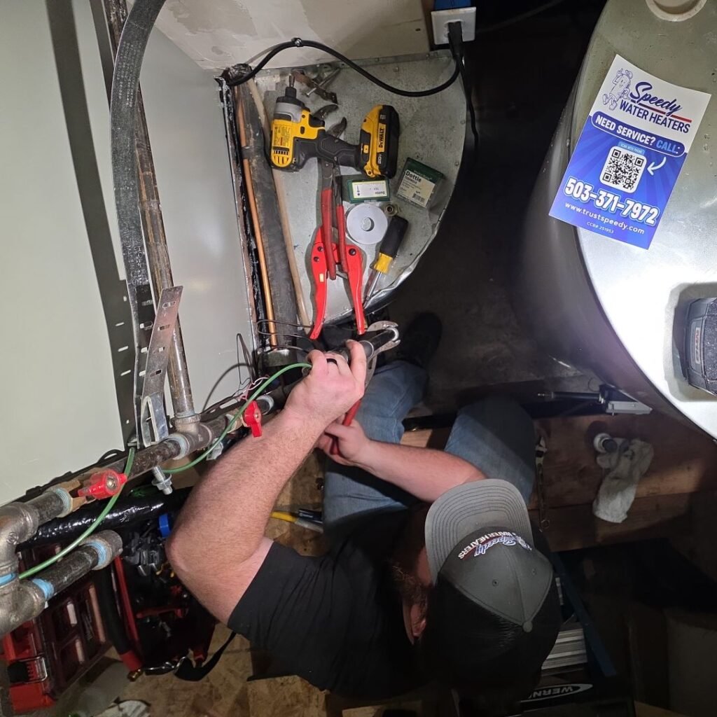 Speedy technician replacing a water heater in a tight utility space