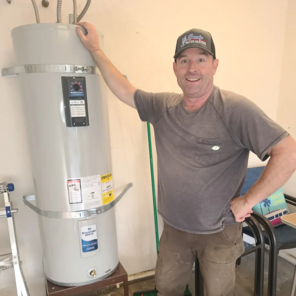 Speedy technician beside a newly installed water heater
